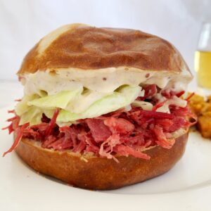 A picture of a corned beef and cabbage sandwich