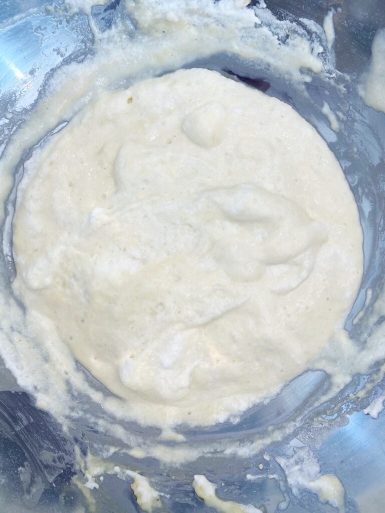 Showing the fluffy consistency of the batter for puffy pancakes 