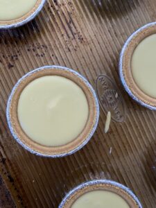 A picture of individual cheesecakes right out of the oven