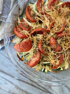 A picture of roasted zucchini and tomatoes with parmesan