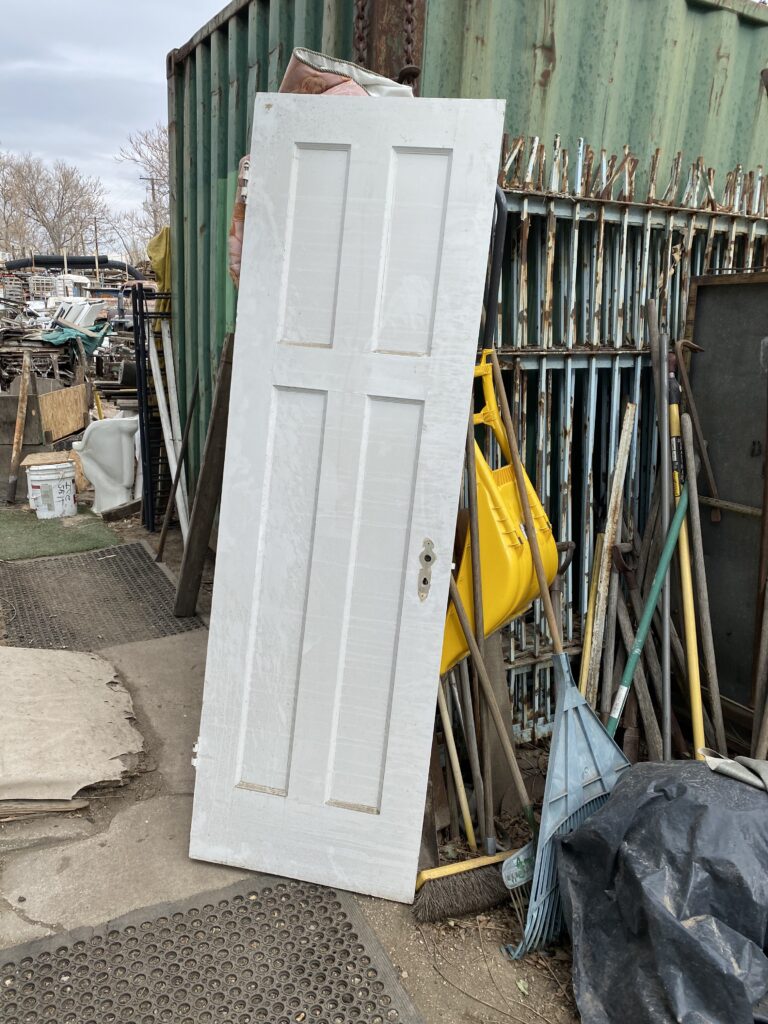 A picture of a salvaged door from an architectural salvage yard 